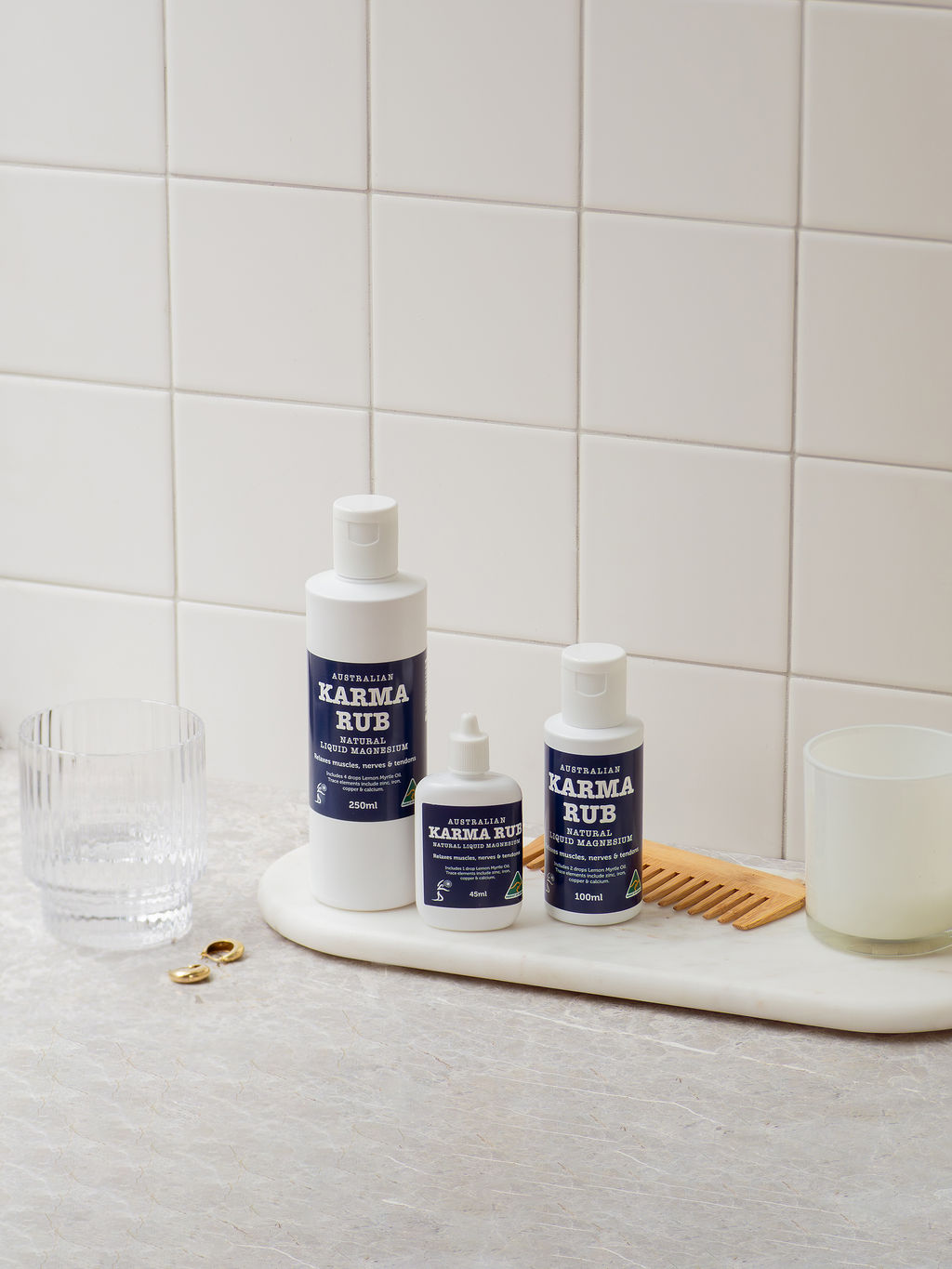 Bottle of Karma Rub Liquid Magnesium, 250ml and 45ml bottles, showing clear labels and liquid magnesium inside.