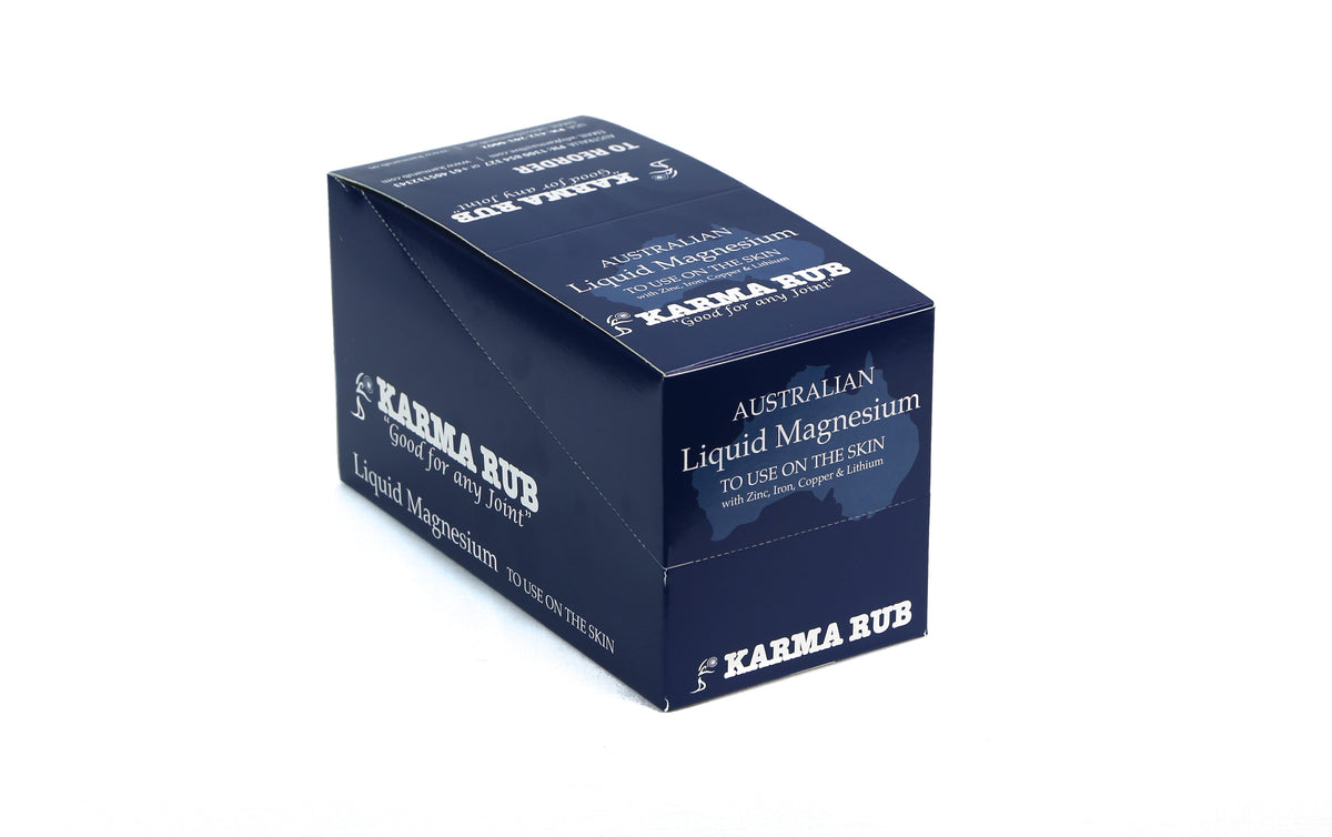 Box of 12 Karma Rub Liquid Magnesium 100ml bottles, showing the closed packaging with product branding and labeling.